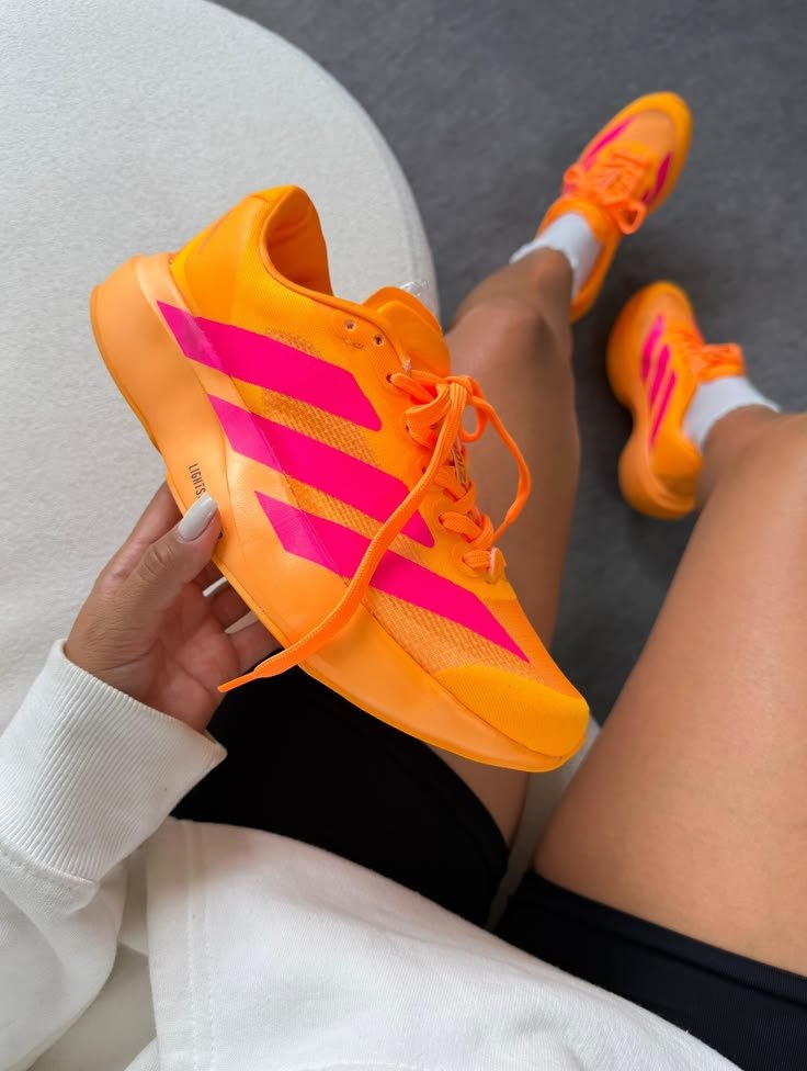 Orange Adidas running shoes